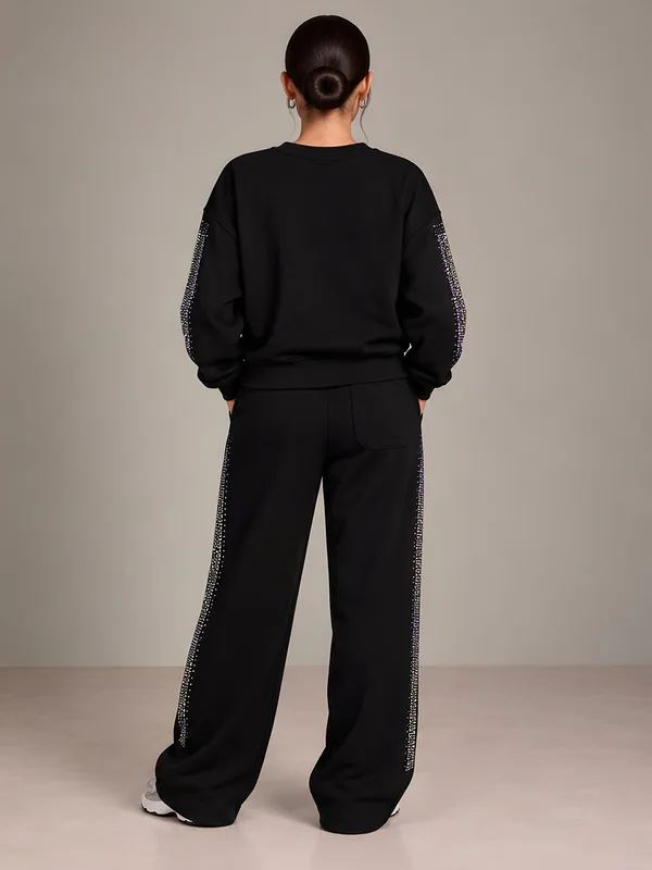 Black sweatshirt and trousers with crystals, back